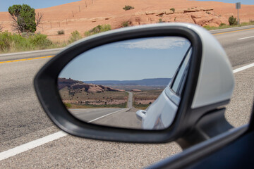 Driving on US route 191. Highway through dessert in rearview