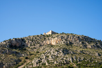 Fototapeta na wymiar Castle on top of a rocky mountain
