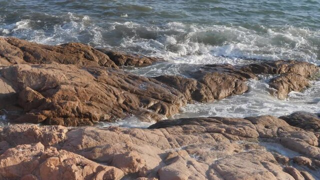 Beautiful shot of rock formations near the sea close to Beach Isola Rossa near Trinità d'Agultu and Vignola, Sardinia - Italy