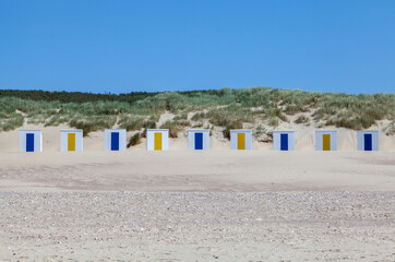 Fototapeta na wymiar colorful beach huts at Cadzand