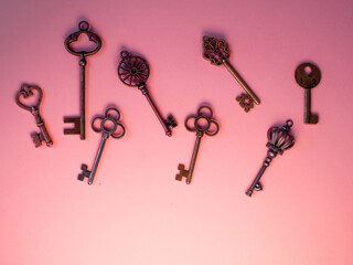 Many different old keys from different locks, in order, flat lay.