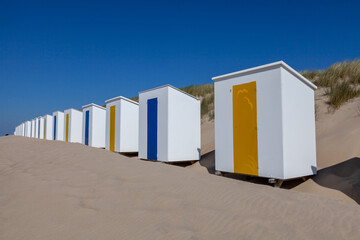 Fototapeta na wymiar colorful beach huts at Cadzand