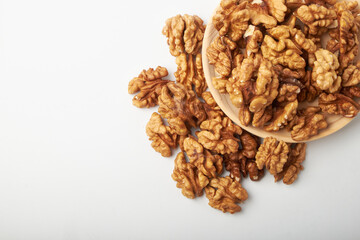 Walnut kernels are isolated on a white background.