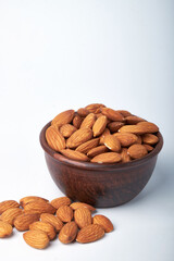 Walnut kernels on a wooden background.Almonds, walnuts and hazelnuts in bowls on a wooden background