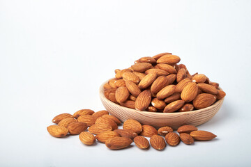 Walnut kernels on a wooden background.Almonds, walnuts and hazelnuts in bowls on a wooden background