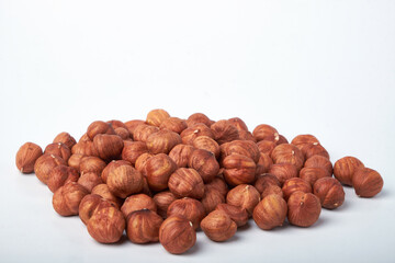 Walnut kernels on a wooden background.Almonds, walnuts and hazelnuts in bowls on a wooden background