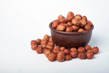 Walnut kernels on a wooden background.Almonds, walnuts and hazelnuts in bowls on a wooden background