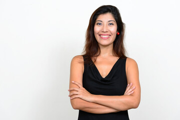 Fototapeta premium Portrait of happy young beautiful woman smiling with arms crossed