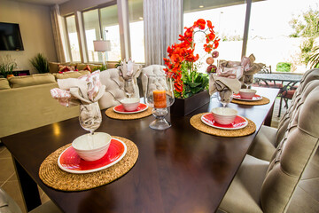 Dining Table With Colorful Centerpiece And Place Settings