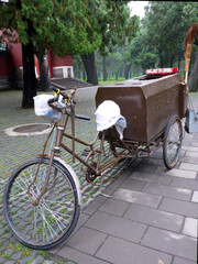 Fototapeta na wymiar Bicycle fitted out for street cleaning in China