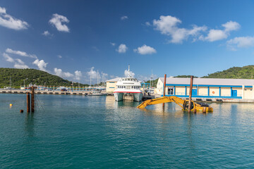 Dredging, pontoon excavator sunk in harbor in Carriacou, Grenada