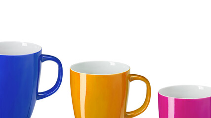 Close-up of three colourful mugs on white background