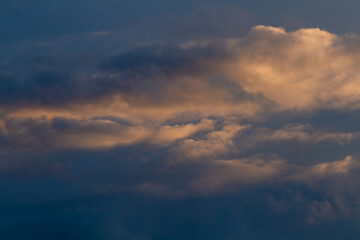 Dark blue sky, close-up cumulus clouds. Natural background.