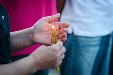 Hands with Memorial Candle