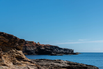 Fototapeta na wymiar Rocky shore of the Mediterranean Sea in Spain on a beautiful sunny day