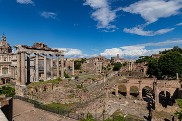 Naklejka premium Panorama of roman forum the heart of roman empire. From the Campidoglio they can be seen the Arch of Severus, the temples Saturn and Vesta, Basilica of Maxentius, Arch of Titus, Colosseum Rome, Italy