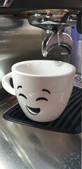 White cup of coffee on coffee machine