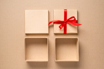 Empty open gift cardboard boxes on a cardboard background. top view