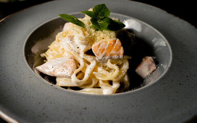 Italian fettuccine pasta with salmon in a creamy sauce