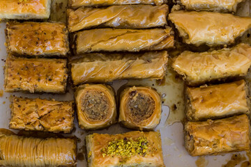 Traditional Turkish Pastry Dessert Baklava in own box on white surface,top view.