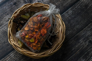 Mixed dried flower in a sachet on a rattan basket