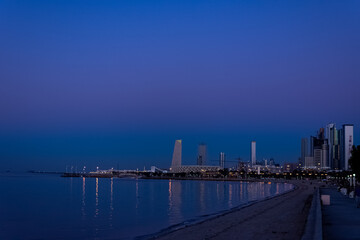 Beautiful landscape of Shuwaikh beach in city of Kuwait during while people are enjoying outside