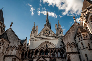 Victorian architectural landmarks, British judiciary and criminal trial concept with photograph of the royal courts of justice is London, UK