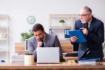 Two employees in pandemic concept at workplace