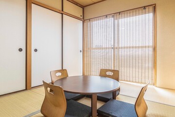 Black wooden table and cushions in the Japanese-style living room