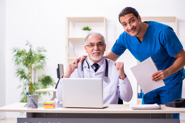 Two male doctors working in the clinic