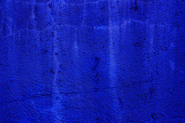 Blue colored abstract wall background with textures of different shades of blue