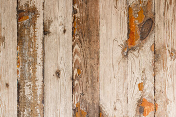 Wood background with grunge texture of old boards, rustic floor with peeling brown red paint, polished planks, close up