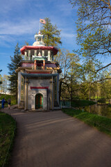 Path among the trees to the entrance to the Pavilion Chinese gazebo in Catherine Park against the...