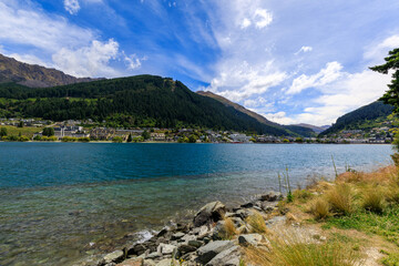 The view from the City Park towards Queenstown, New Zealand, on a blue sky day