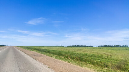 Fototapeta na wymiar Ufa, Russia June 20, 2020 view from a driving car to the road on a sunny day