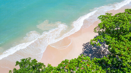 Aerial view landscape of beautiful tropical beach, top view from drone, Aerial view of sandy beach and ocean with waves with palms on the sandy beach, Ao Nang, Krabi, Thailand.