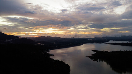 Aerial view of Kenyir Lake during blue hour sunrise.