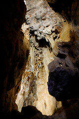 The calcite in the mineral water creates castings and stalactites within the natural caves.