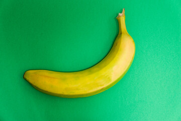 Delicious fresh banana on green background. Isolated