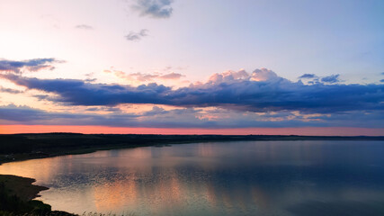 Fototapeta na wymiar Ufa, Russia June 20, 2020 view of the reservoir on a sunny evening with clouds