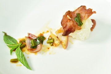  Thai spicy grilled  pork salad and sticky rice on plate