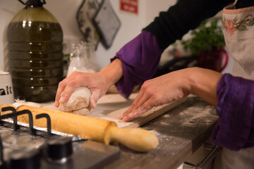 close up of hands making a cake