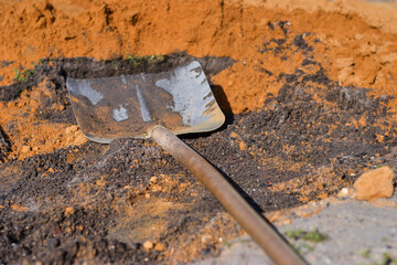 Orange and gray Sand with Shovel photogarphy