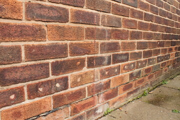 house wall that has had the cavity wall insulation holes filled in - 367142777