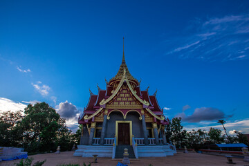 Background of Wat Pha Tak Suea, which is located on a mountain and offers views of neighboring countries such as Laos, the Mekong River, beautiful pagodas and churches for tourists to make merit.