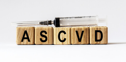 Text ASCVD made from wooden cubes. White background