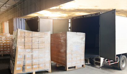 Road freight cargo shipment by truck. Large shipments pallet goods waiting for load into container shipping truck. Logistics and transportation.