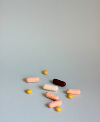 Pills on a colored background. Tablets of different colors.