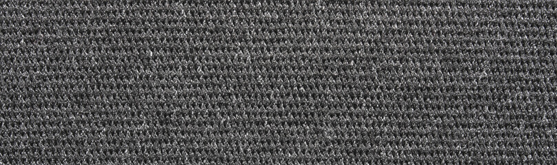 The texture of a dense gray carpet.Grey carpet background.