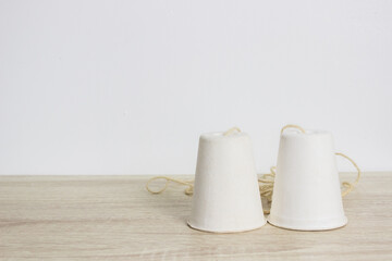 paper phone cups toy on wood table